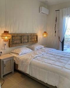 Giường trong phòng chung tại Deja Blue Villa 1
