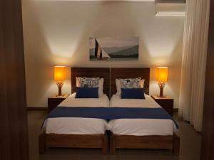 Postel nebo postele na pokoji v ubytování Penthouse 3 chambres Vue Lagon imprenable