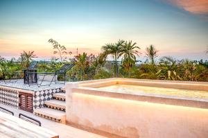 a swimming pool on the roof of a house at 305 Luxury Penthouse with Private Pool in Tulum