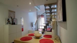 a room with a table with red mats on it at Apartment Ena - Lavica in Podstrana