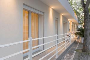 a balcony of a house with a tree at Residence Armony in Misano Adriatico +270 photos