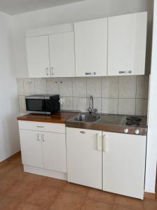 Kuchyňa alebo kuchynka v ubytovaní Melita Apartements