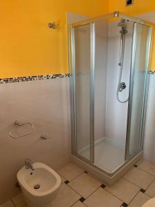 a bathroom with a shower and a toilet at il borghetto Bennie en Liisa in Cupra Marittima