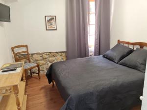 Postel nebo postele na pokoji v ubytování Hostellerie du Vieux Moulin + 8 fotografií