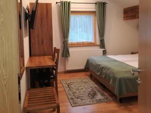Ein Bett oder Betten in einem Zimmer der Unterkunft Haus Planegg L