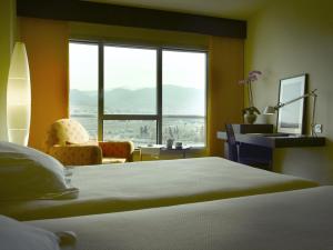 Posteľ alebo postele v izbe v ubytovaní Hotel Abades Nevada Palace