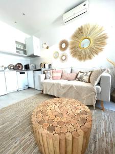 a living room with a couch and a table at Beach House Old Town in Cascais