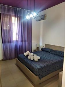 Postel nebo postele na pokoji v ubytování iMama' Rooms