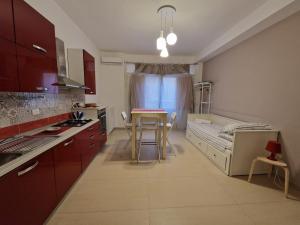 Kuchyň nebo kuchyňský kout v ubytování iMama' Rooms