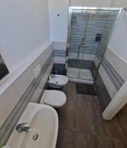 Koupelna v ubytování iMama' Rooms