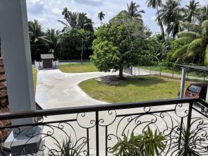 a balcony with a view of a park at Darney's Homestay Kg Bangau Tanjung in Temerloh