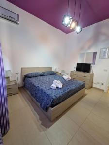 Postel nebo postele na pokoji v ubytování iMama' Rooms