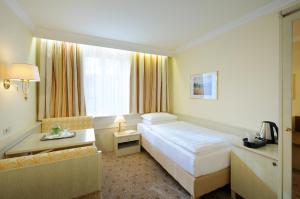 Voodi või voodid majutusasutuse Hotel Scherer toas