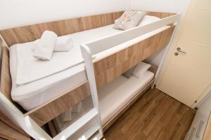 Postel nebo postele na pokoji v ubytování Apartments Luka i Toni