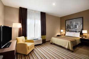 Ein Bett oder Betten in einem Zimmer der Unterkunft Super 8 by Wyndham Hershey Chocolate Avenue