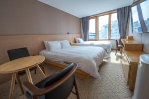 Postelja oz. postelje v sobi nastanitve Jongno Hotel Lumia