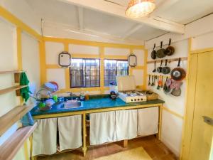 a kitchen with a sink and a counter top at Unicorn Reborn - Peaceful Rentals in San Marcos La Laguna