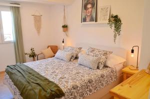 a bedroom with a bed with pillows on it at Apartman Paula in Milna