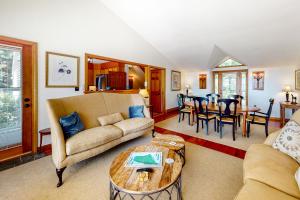 a living room with a couch and a table at Beautiful Oceanside House in Falmouth