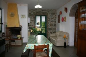 a living room with a table and a couch at Villa Cantagallo in Cortona