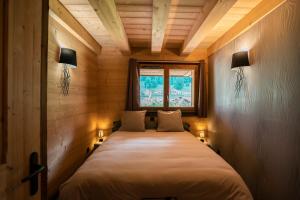 Postel nebo postele na pokoji v ubytování CHALET LES CERFS