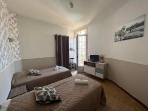 Ein Bett oder Betten in einem Zimmer der Unterkunft Hôtel Restaurant Le Saint Gillois