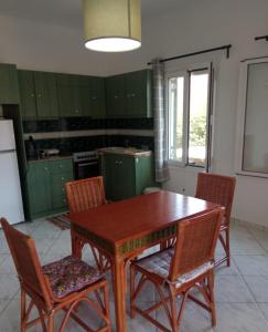 A kitchen or kitchenette at Marilena House Plataria