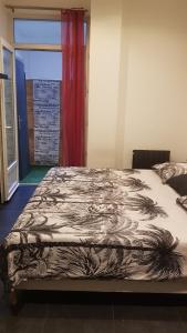 a bedroom with a bed with a blanket on it at LOFT 100m2 in Toulon
