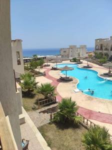 a view of a resort with a swimming pool at Sunny dahab in Dahab