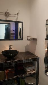a bathroom with a sink and a mirror at LOFT 100m2 in Toulon