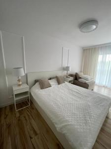 Postel nebo postele na pokoji v ubytování Luksusowy Apartament na Wydmach Międzywodzie