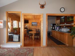 a kitchen and dining room with a table and chairs at Alpine Inn in Pagosa Springs