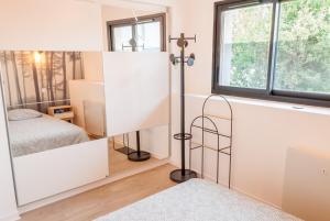 Ένα ή περισσότερα κρεβάτια σε δωμάτιο στο Maison avec terrasse plein sud à 7 min de la gare