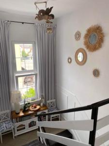 a room with a window and a chair and a table at Pod Aniołem in Mielno