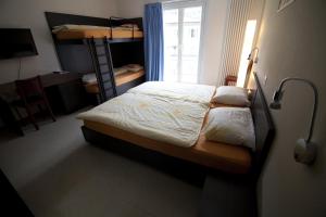 Katil atau katil-katil dalam bilik di Albergo Elvezia