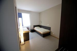 Katil atau katil-katil dalam bilik di Albergo Elvezia