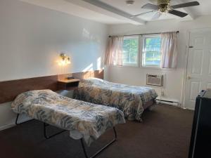 Postel nebo postele na pokoji v ubytování Norfolk Motel