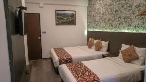 Postel nebo postele na pokoji v ubytování Highlanders Hotel