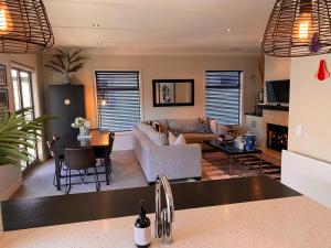 a living room with a couch and a table at Cardrona Ski Apartment in Wanaka