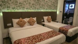 Postel nebo postele na pokoji v ubytování Highlanders Hotel