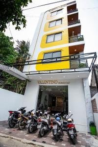 a group of motorcycles parked in front of a building at Valentino Homestay in Hue