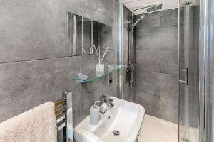 a bathroom with a sink and a shower at Carr House Farm in Glossop +41 photos