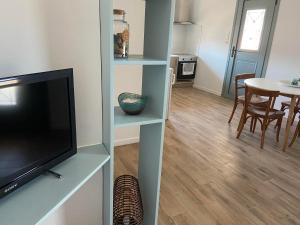 A television and/or entertainment centre at Menta House