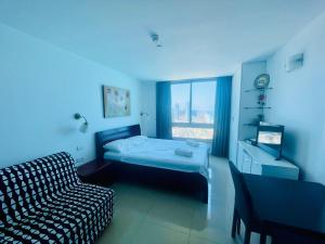 Postel nebo postele na pokoji v ubytování Sea Breeze Apartments