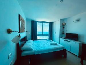 Postel nebo postele na pokoji v ubytování Sea Breeze Apartments