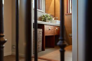 a bathroom with a sink and a counter top at Kanuka Terrace - Luxury Strawbale House in Kaikoura +39 photos