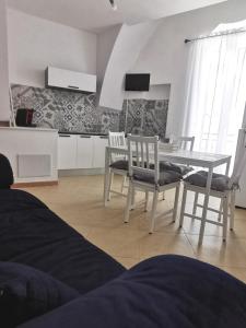 Kuchyň nebo kuchyňský kout v ubytování Stella Murgiana + 24 fotografií