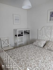 Säng eller sängar i ett rum på Residencial "La Ventilla"
