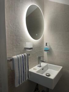 a bathroom with a sink and a mirror at Nikiti, four seasons house in Nikiti +19 photos