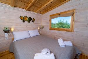 Tempat tidur dalam kamar di Thalassa Green
